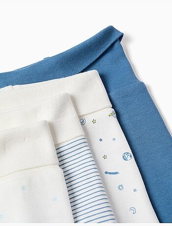 4 pantalones con pies de algodón lisos/estampados