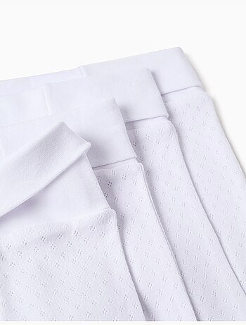 4 pantalones con pies en algodón perchado