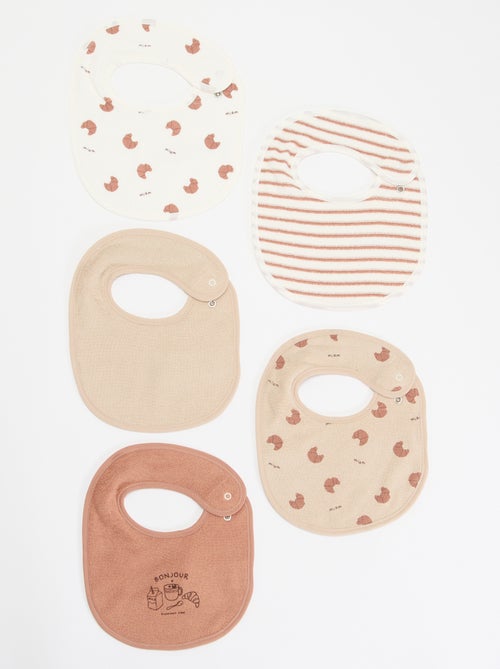 5 baberos con estampados divertidos y cierre a presión - Kiabi 5 baberos con estampados divertidos y cierre a presión - Kiabi