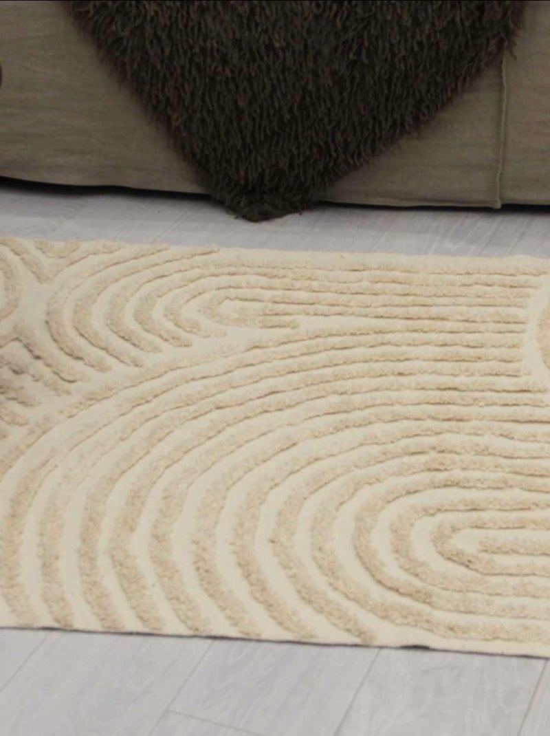 Alfombra con relieve de círculos curvos Crudo - Kiabi
