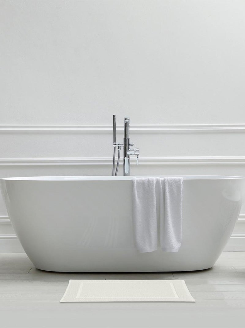 Alfombra de baño rectangular Genova 50x70 cm algodón rizo uni verde Guy Levasseur Crudo - Kiabi