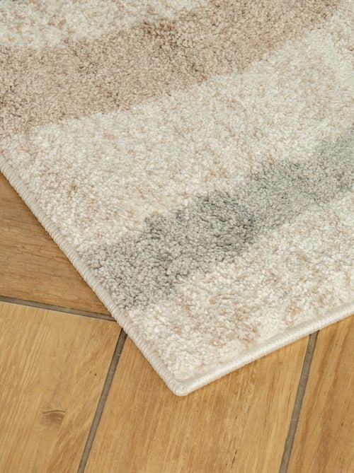 Alfombra decorativa de interior con diseño abstracto - Kiabi Alfombra decorativa de interior con diseño abstracto - Kiabi
