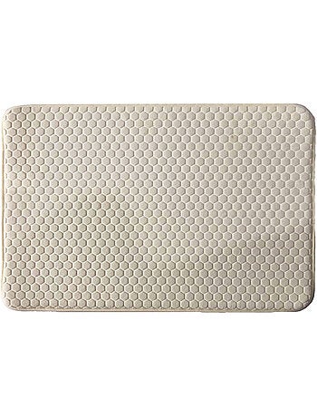 Alfombrilla de baño de espuma viscoelástica con diseño de panal.