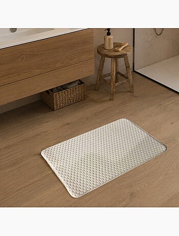 Alfombrilla de baño de espuma viscoelástica con diseño de panal.