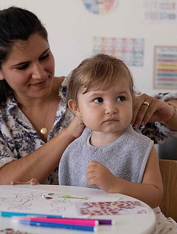 Babero con botones a presión
