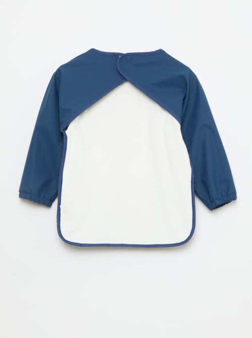 Babero delantal de manga larga estampado - Kiabi Babero delantal de manga larga estampado - Kiabi