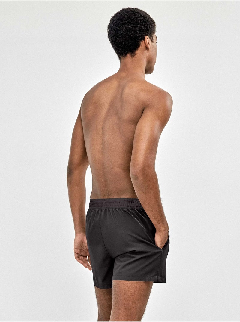 Bañador de hombre ajustable en cintura tejido de secado rápido Negro - Kiabi
