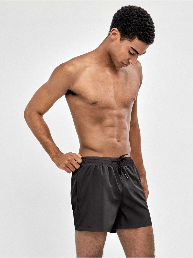 Bañador de hombre ajustable en cintura tejido de secado rápido Negro - Kiabi