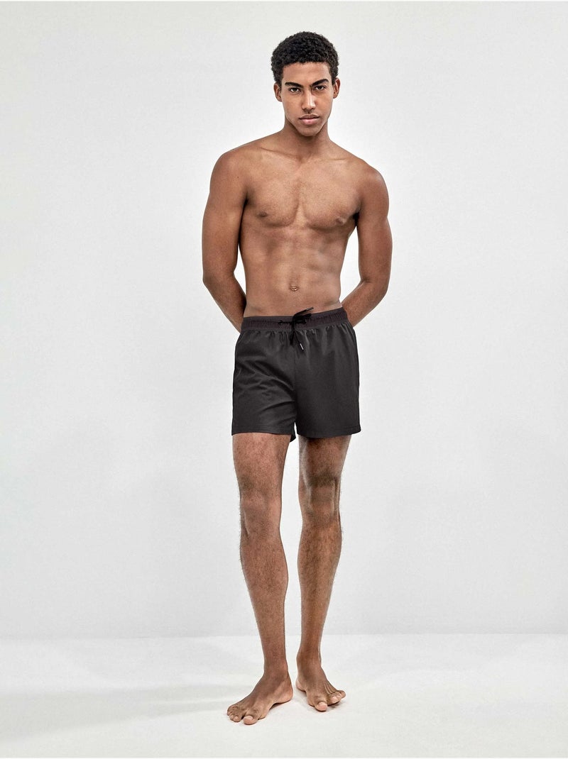 Bañador de hombre ajustable en cintura tejido de secado rápido Negro - Kiabi