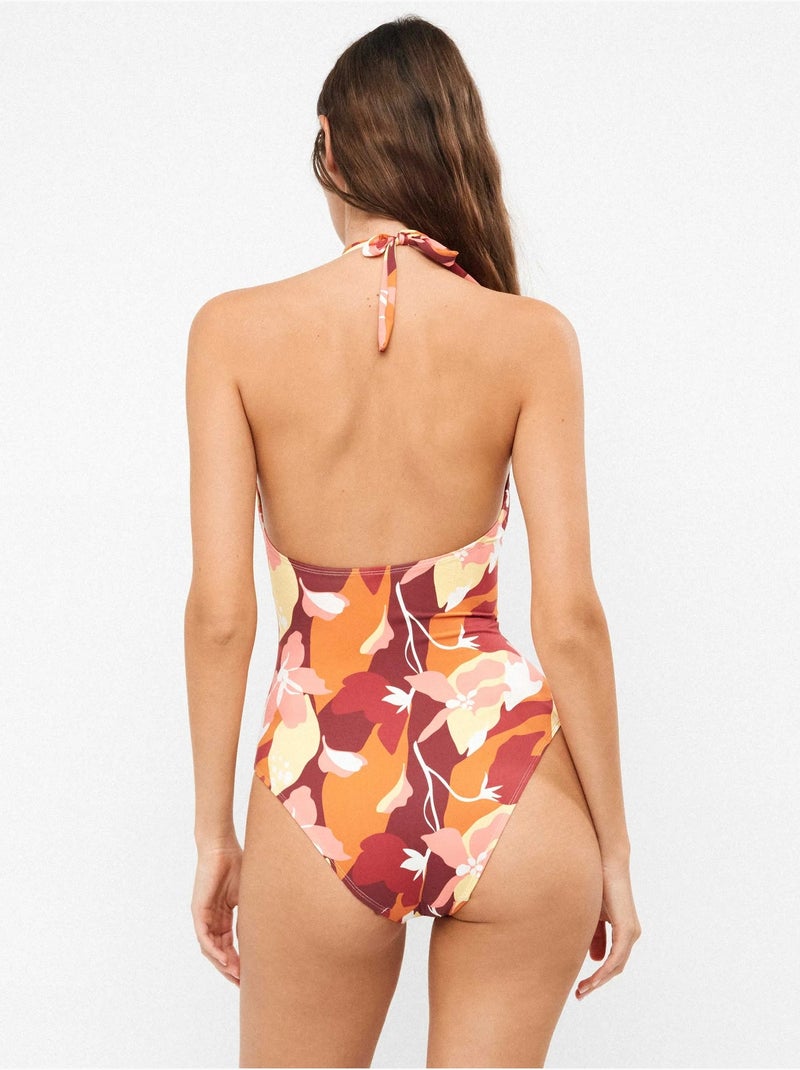 Bañador halter con foam fijo y detalle metálico en v en escote Multicolor - Kiabi