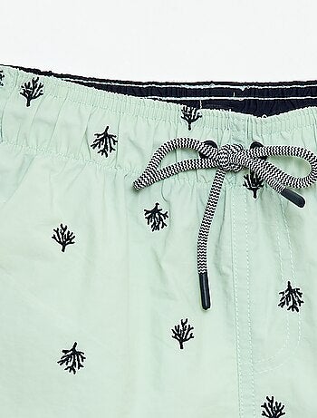 Bermuda de baño estampado integral con motivos tropicales