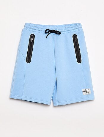 Bermuda de felpa con bolsillos con cremallera