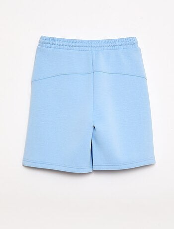 Bermuda de felpa con bolsillos con cremallera