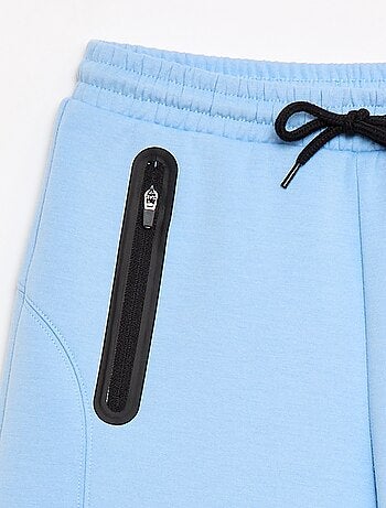 Bermuda de felpa con bolsillos con cremallera