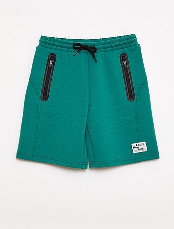 Bermuda de felpa con bolsillos con cremallera