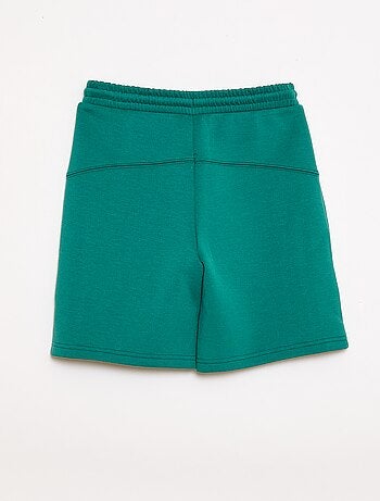 Bermuda de felpa con bolsillos con cremallera