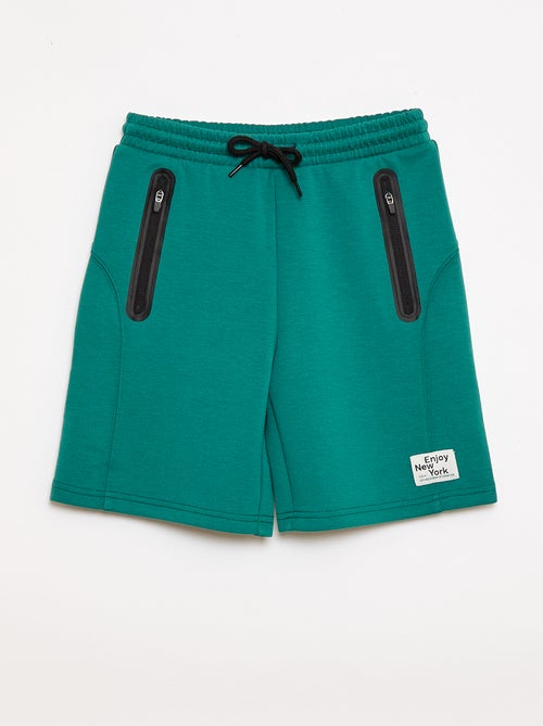 Bermuda de felpa con bolsillos con cremallera - Kiabi