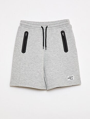Bermuda de felpa con bolsillos con cremallera