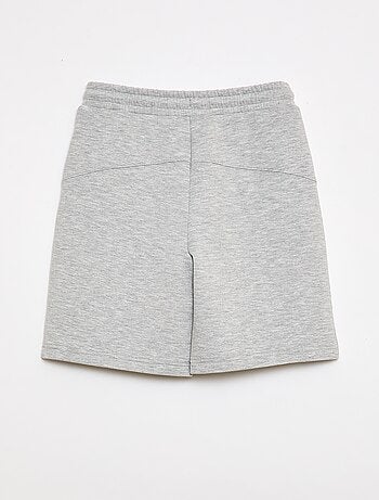 Bermuda de felpa con bolsillos con cremallera