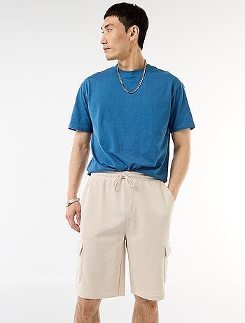 Bermuda de felpa ligera con bolsillos con solapa