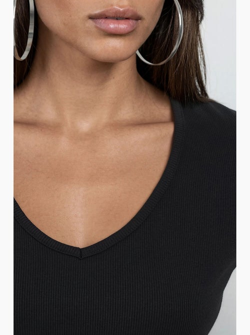 Blusa acanalada con cuello en v busem - Kiabi Blusa acanalada con cuello en v busem - Kiabi