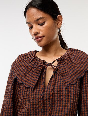 Blusa con cuello bebé amplio