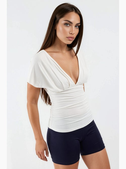 Blusa con cuello en v y detalle de lazo busem - Kiabi Blusa con cuello en v y detalle de lazo busem - Kiabi