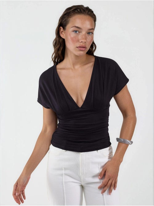 Blusa con cuello en v y detalle de lazo busem - Kiabi Blusa con cuello en v y detalle de lazo busem - Kiabi