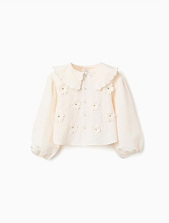Blusa con mangas abullonadas y aplique floral