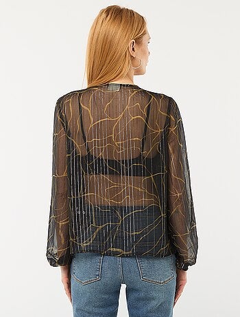 Blusa con motivo e hilos plateados en malla fluida transparente