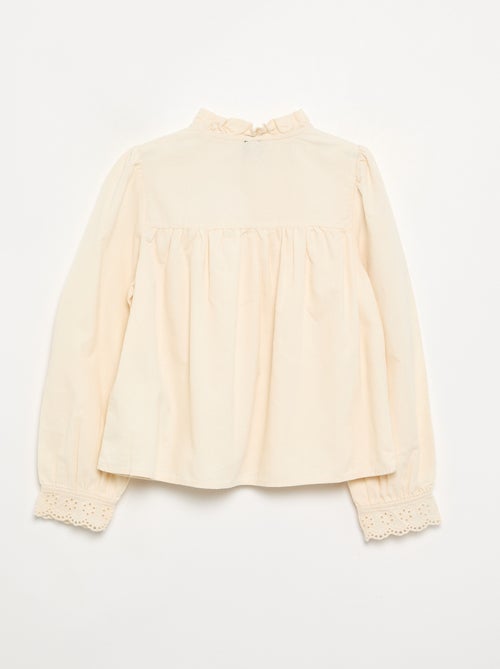 Blusa con puños bordados y cuello con volantes - Kiabi Blusa con puños bordados y cuello con volantes - Kiabi