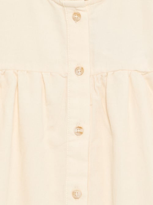 Blusa con puños bordados y cuello con volantes - Kiabi Blusa con puños bordados y cuello con volantes - Kiabi