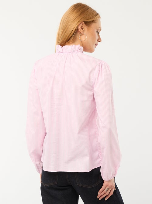 Blusa con volantes en el cuello y en la abertura - Kiabi Blusa con volantes en el cuello y en la abertura - Kiabi