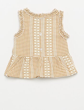 Blusa con volantes en las sisas