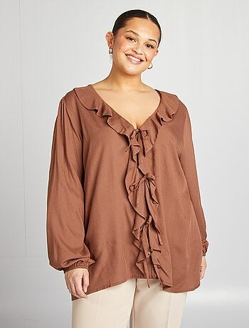 Blusa con volantes y cintas
