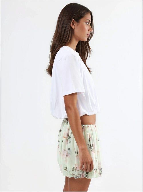 Blusa corta con cuello redondo y elástico busem - Kiabi Blusa corta con cuello redondo y elástico busem - Kiabi