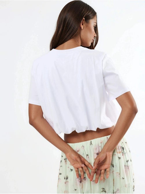 Blusa corta con cuello redondo y elástico busem - Kiabi Blusa corta con cuello redondo y elástico busem - Kiabi