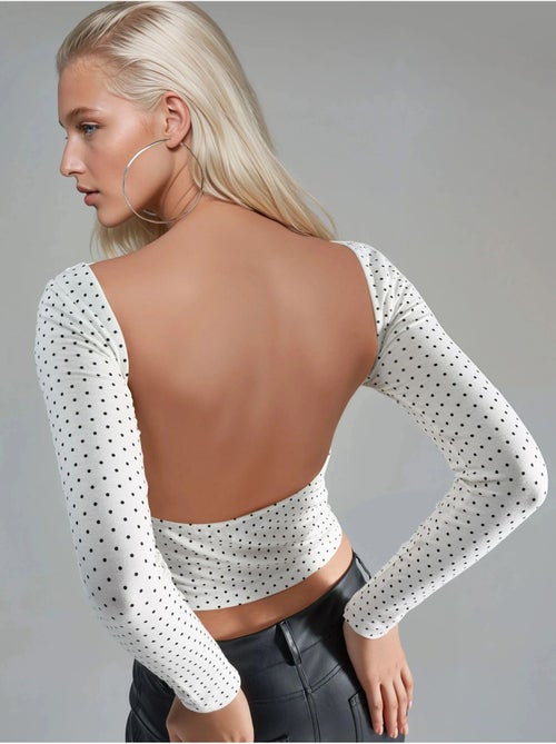 Blusa corta entallada de lunares con cuello en u de busem - Kiabi Blusa corta entallada de lunares con cuello en u de busem - Kiabi