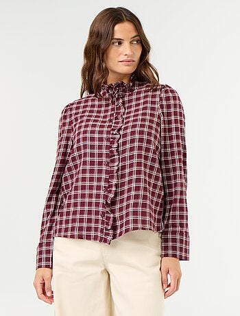 Blusa de cuello alto con volantes