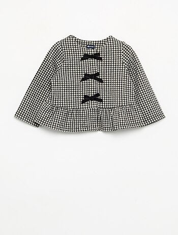 Blusa de franela con lazos y bajo con volante