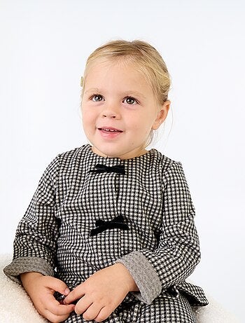 Blusa de franela con lazos y bajo con volante