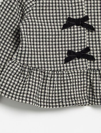Blusa de franela con lazos y bajo con volante