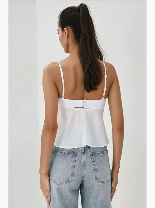 Blusa de tacto suave con escote en v y detalle de lazo hiccup - Kiabi Blusa de tacto suave con escote en v y detalle de lazo hiccup - Kiabi
