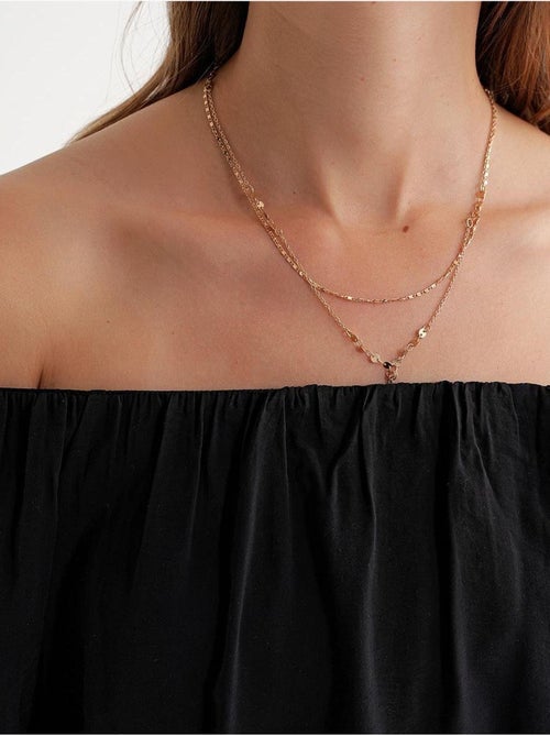 Blusa fina de modal y poliéster con cuello madonna y detalle de volante mixray - Kiabi Blusa fina de modal y poliéster con cuello madonna y detalle de volante mixray - Kiabi