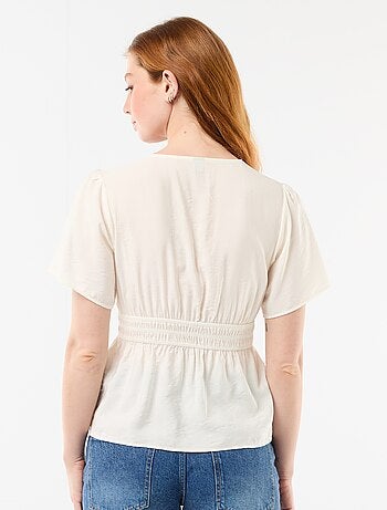 Blusa fluida de corte acampanado