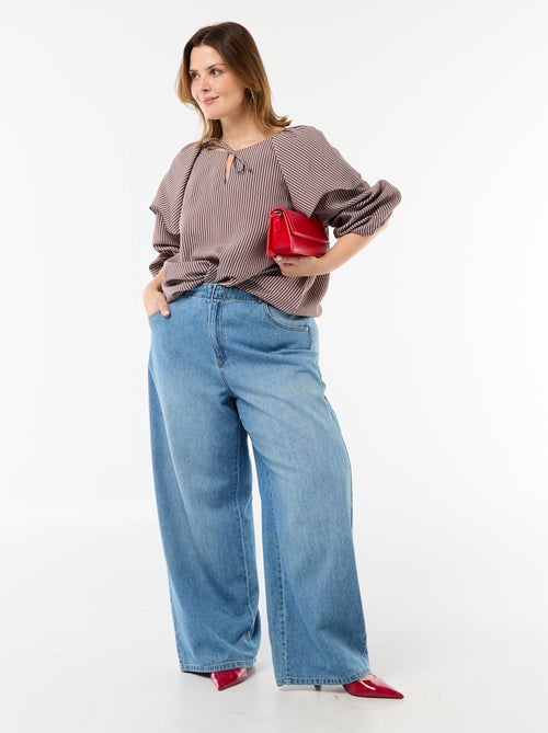 Blusa fluida de manga larga con volante grande en el cuello - Kiabi Blusa fluida de manga larga con volante grande en el cuello - Kiabi