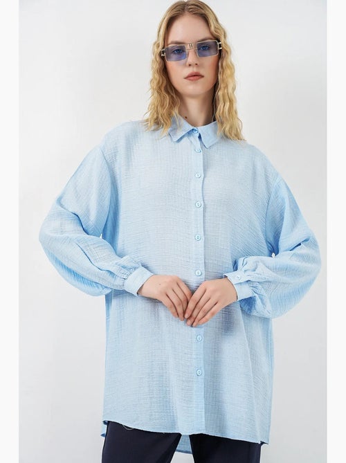 Blusa larga oversize texturizada con cuello de camisa bdart - Kiabi Blusa larga oversize texturizada con cuello de camisa bdart - Kiabi