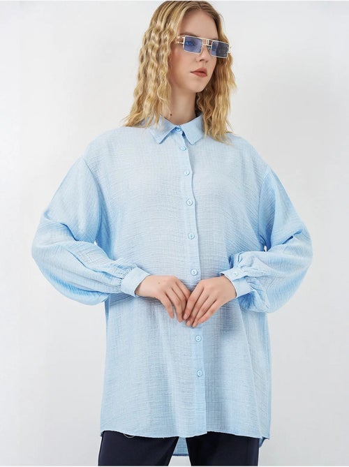 Blusa larga oversize texturizada con cuello de camisa bdart - Kiabi Blusa larga oversize texturizada con cuello de camisa bdart - Kiabi