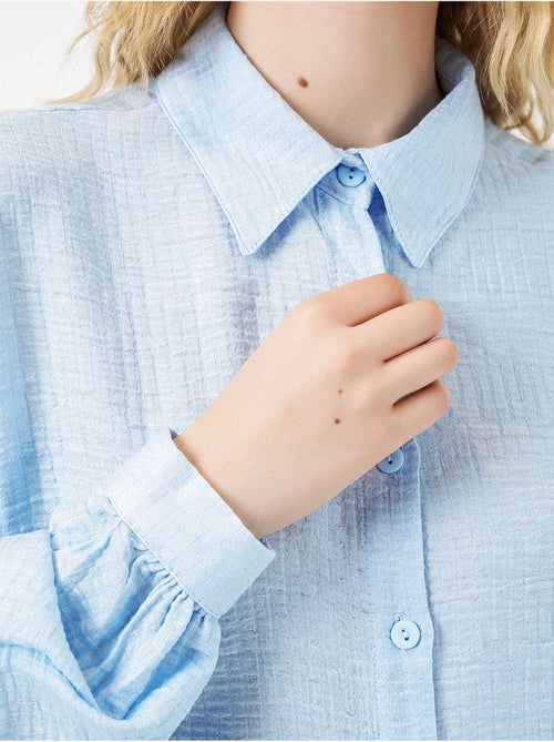 Blusa larga oversize texturizada con cuello de camisa bdart - Kiabi Blusa larga oversize texturizada con cuello de camisa bdart - Kiabi