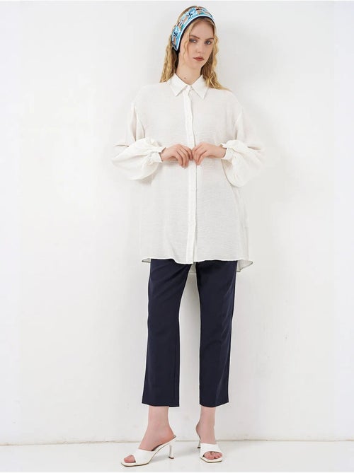 Blusa larga oversize texturizada con cuello de camisa bdart - Kiabi Blusa larga oversize texturizada con cuello de camisa bdart - Kiabi